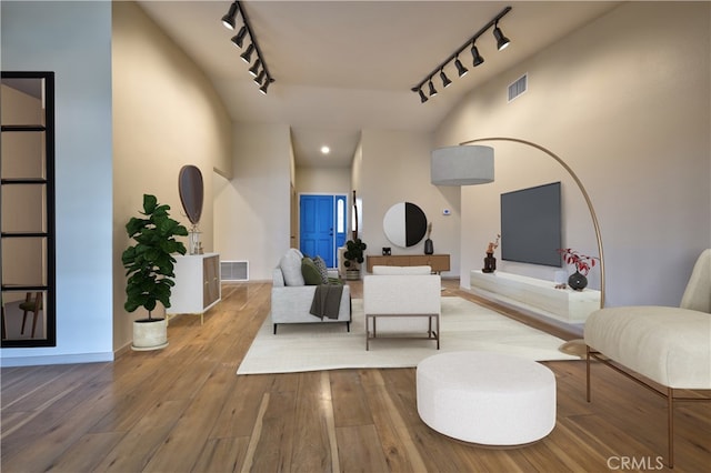4163 Alma Ct, Chino, CA 91710 - living room with rail lighting and hardwood / wood-style flooring