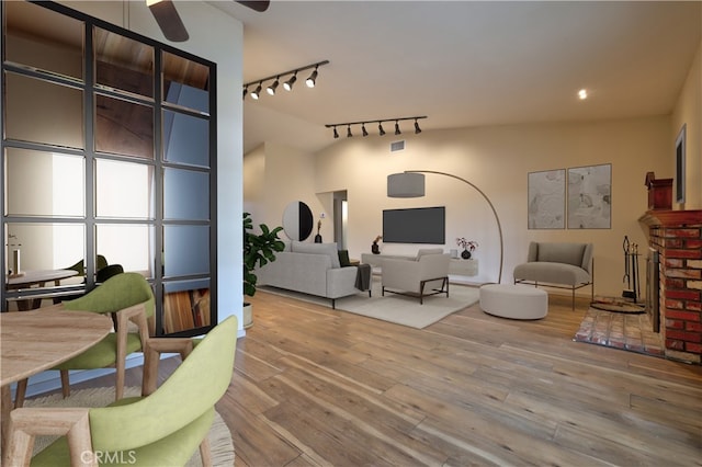 4163 Alma Ct, Chino, CA 91710 - living room with track lighting, hardwood / wood-style floors, and a ceiling fan