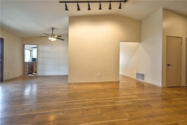 4163 Alma Ct, Chino, CA 91710 - unfurnished living room featuring lofted ceiling, a ceiling fan, track lighting, and light wood finished floors