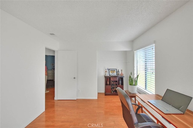 22784 Wren St, Grand Terrace, CA 92313 - office featuring light wood finished floors, a textured ceiling, and baseboards