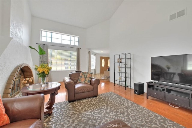 22784 Wren St, Grand Terrace, CA 92313 - living room featuring wood finished floors and high vaulted ceiling