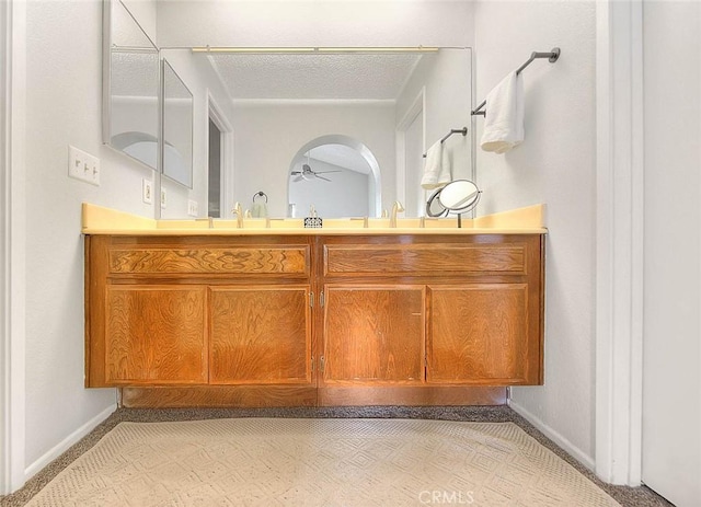 22784 Wren St, Grand Terrace, CA 92313 - bathroom featuring a ceiling fan, vanity, baseboards, and a textured ceiling