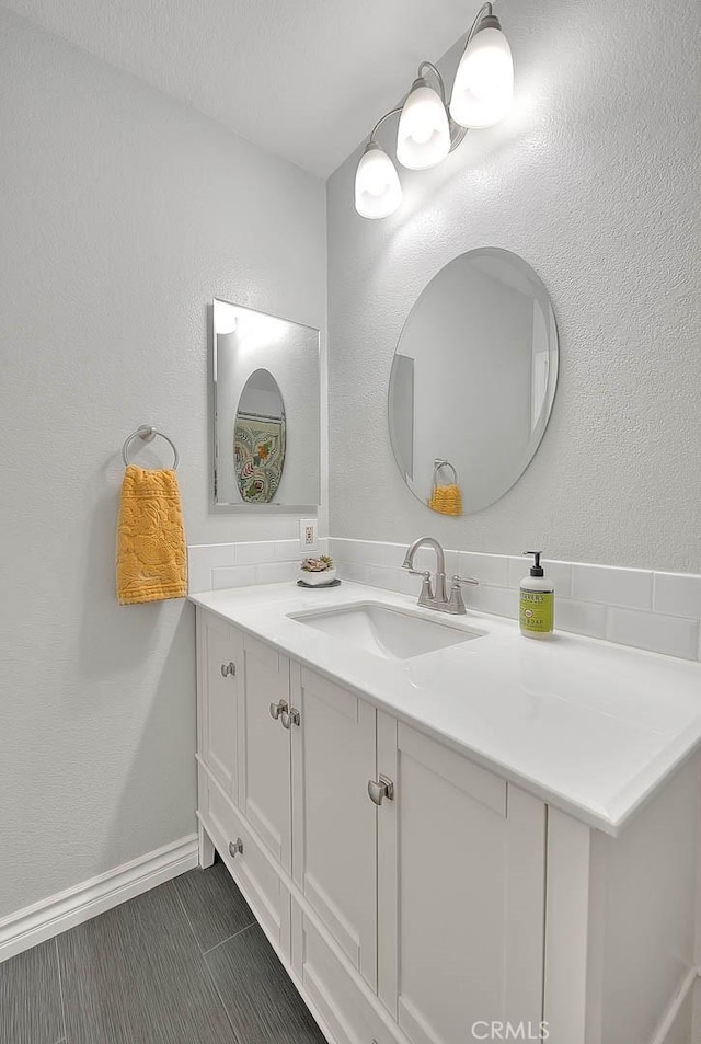 22784 Wren St, Grand Terrace, CA 92313 - bathroom with vanity, baseboards, and tile patterned flooring