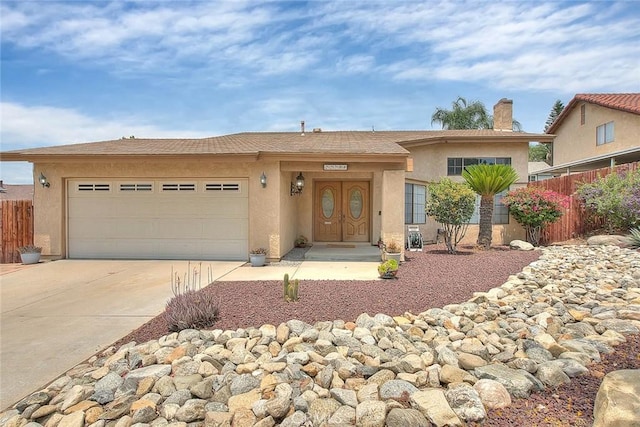 22784 Wren St, Grand Terrace, CA 92313 - ranch-style home with concrete driveway, a garage, stucco siding, and a chimney