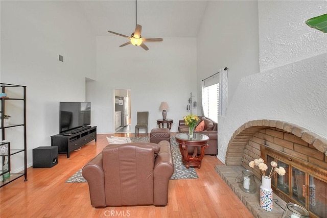 22784 Wren St, Grand Terrace, CA 92313 - living area with high vaulted ceiling, a ceiling fan, wood finished floors, and baseboards