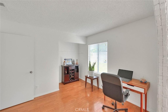 22784 Wren St, Grand Terrace, CA 92313 - office space with a textured ceiling, light wood-style flooring, and baseboards