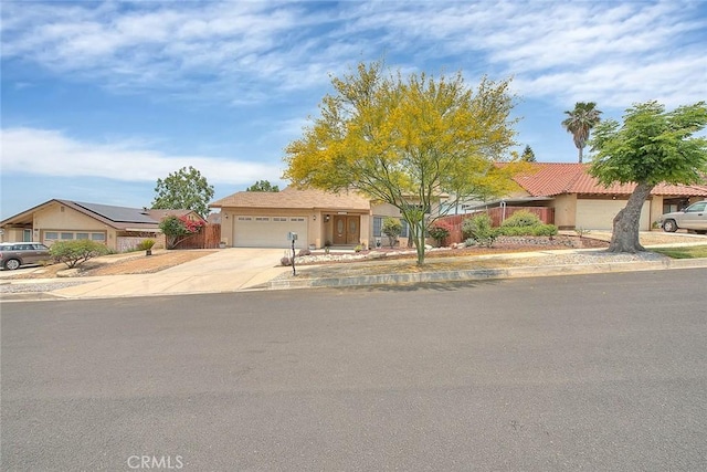 22784 Wren St, Grand Terrace, CA 92313 - single story home featuring a garage, concrete driveway, and stucco siding