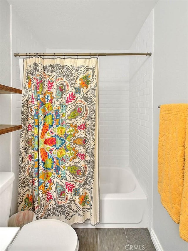 22784 Wren St, Grand Terrace, CA 92313 - full bath with toilet, shower / bath combo with shower curtain, and baseboards