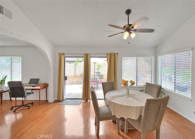 22784 Wren St, Grand Terrace, CA 92313 - dining area featuring a textured ceiling, vaulted ceiling, light wood-style floors, ceiling fan, and baseboards