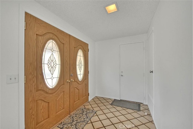 22784 Wren St, Grand Terrace, CA 92313 - foyer with a textured ceiling and light tile patterned floors