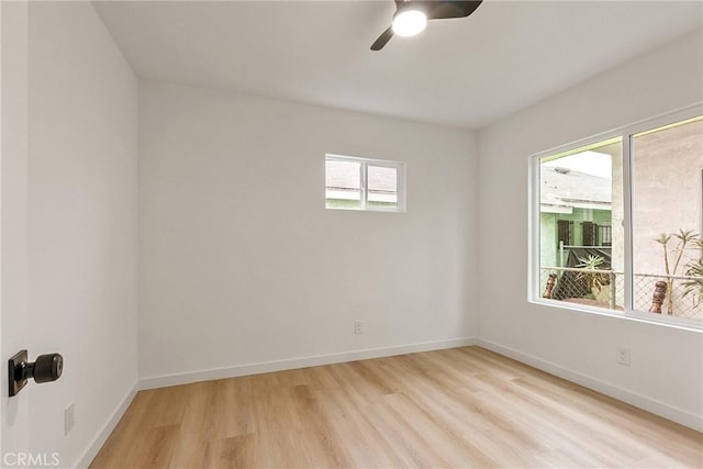 1209 W 40th Pl, Los Angeles, CA 90037 - unfurnished room with light wood-style floors, a ceiling fan, and baseboards