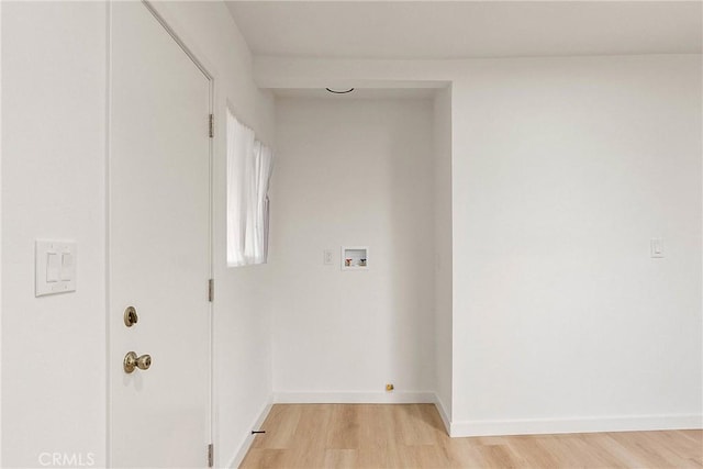 1209 W 40th Pl, Los Angeles, CA 90037 - washroom with light wood-style flooring, baseboards, and washer hookup