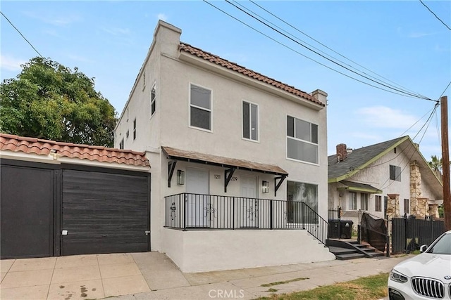 1209 W 40th Pl, Los Angeles, CA 90037 - view of front of property featuring stucco siding and a tiled roof