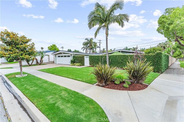 249 Loyola Rd, Costa Mesa, CA 92626 - view of front facade featuring driveway, a front yard, and an attached garage