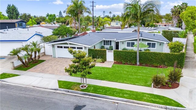 249 Loyola Rd, Costa Mesa, CA 92626 - ranch-style home featuring driveway, an attached garage, and a residential view
