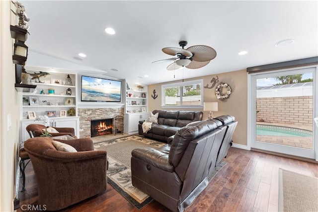 249 Loyola Rd, Costa Mesa, CA 92626 - living room with ceiling fan, a stone fireplace, dark wood-style floors, recessed lighting, and lofted ceiling