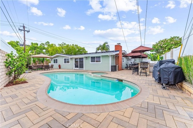 249 Loyola Rd, Costa Mesa, CA 92626 - view of pool with outdoor dining space, a patio area, and a pool with connected hot tub