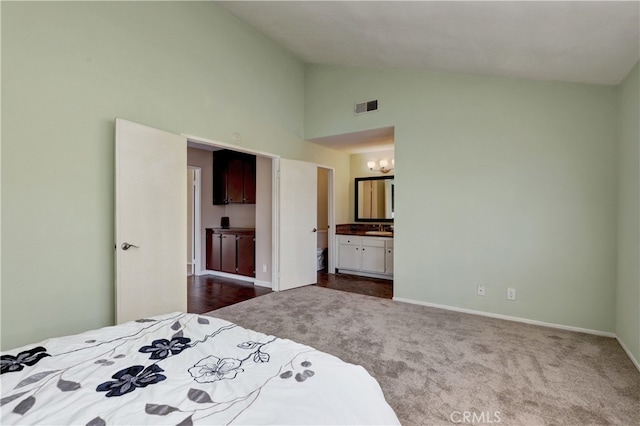 7068 Cerritos Ave Unit 16, Stanton, CA 90680 - bedroom featuring high vaulted ceiling, dark colored carpet, baseboards, a sink, and a chandelier