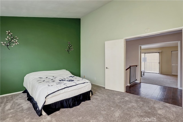 7068 Cerritos Ave Unit 16, Stanton, CA 90680 - carpeted bedroom featuring baseboards and high vaulted ceiling