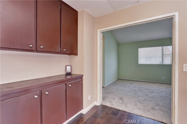 7068 Cerritos Ave Unit 16, Stanton, CA 90680 - hallway featuring dark wood finished floors, baseboards, and dark colored carpet