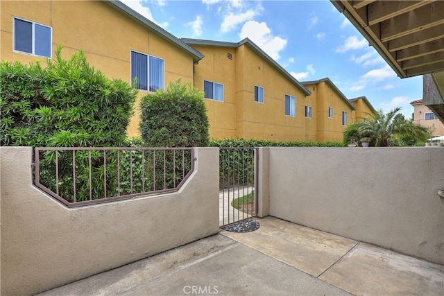 7068 Cerritos Ave Unit 16, Stanton, CA 90680 - view of patio / terrace featuring a gate