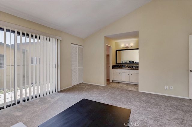 7068 Cerritos Ave Unit 16, Stanton, CA 90680 - exercise room featuring carpet flooring, baseboards, and lofted ceiling