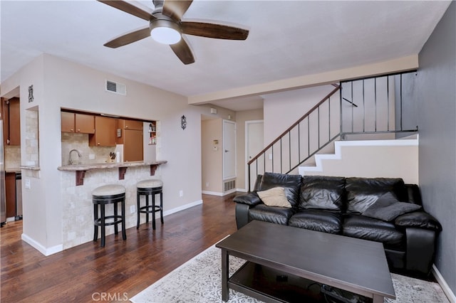 7068 Cerritos Ave Unit 16, Stanton, CA 90680 - living room with dark wood-style flooring, a ceiling fan, baseboards, and stairway