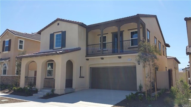 7739 Lupin St, Chino, CA 91708 - mediterranean / spanish-style home with a porch, stucco siding, a balcony, and an attached garage