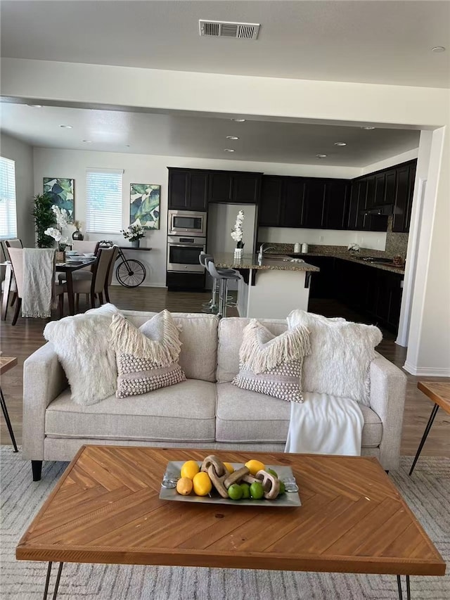 7739 Lupin St, Chino, CA 91708 - living area with wood finished floors and recessed lighting