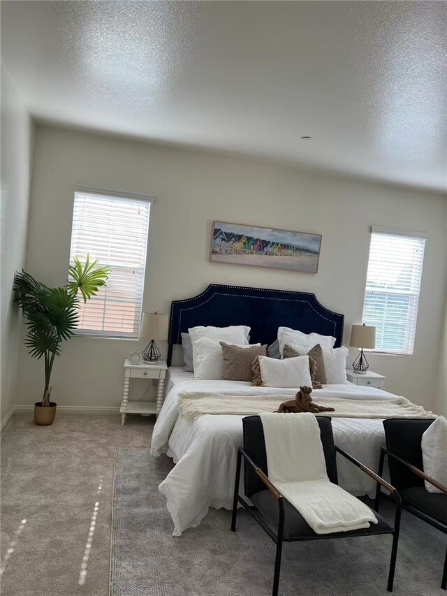 7739 Lupin St, Chino, CA 91708 - bedroom featuring a textured ceiling, carpet flooring, and baseboards