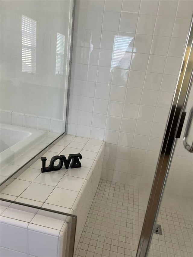 7739 Lupin St, Chino, CA 91708 - full bath with tile patterned floors, a stall shower, and a tub