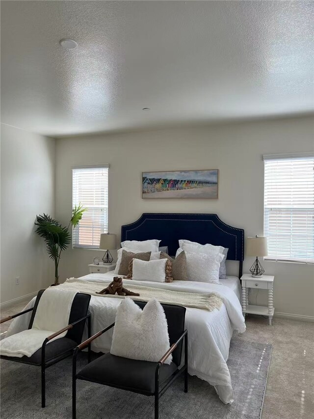 7739 Lupin St, Chino, CA 91708 - carpeted bedroom featuring a textured ceiling and baseboards