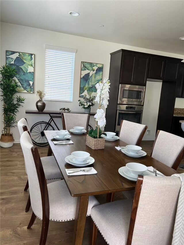7739 Lupin St, Chino, CA 91708 - dining space featuring wood finished floors