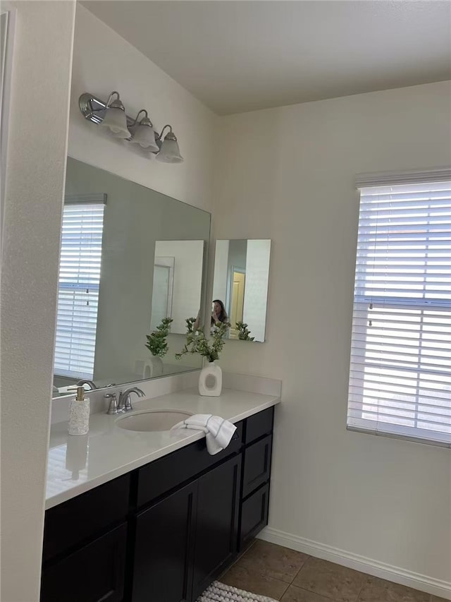 7739 Lupin St, Chino, CA 91708 - bathroom featuring vanity, tile patterned flooring, and baseboards