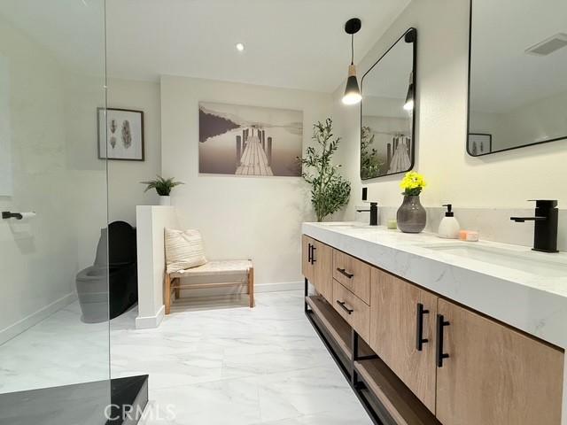 1254 W Van Koevering St, Rialto, CA 92376 - full bathroom with double vanity and marble finish flooring