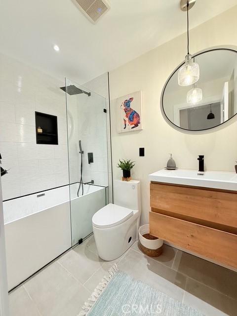 1254 W Van Koevering St, Rialto, CA 92376 - full bathroom with vanity, walk in shower, and tile patterned flooring
