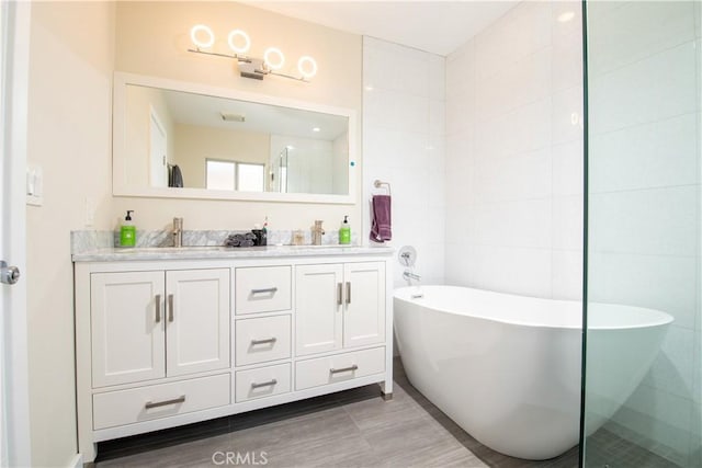 5427 Noble Ave, Sherman Oaks, CA 91411 - bathroom featuring double vanity and a soaking tub