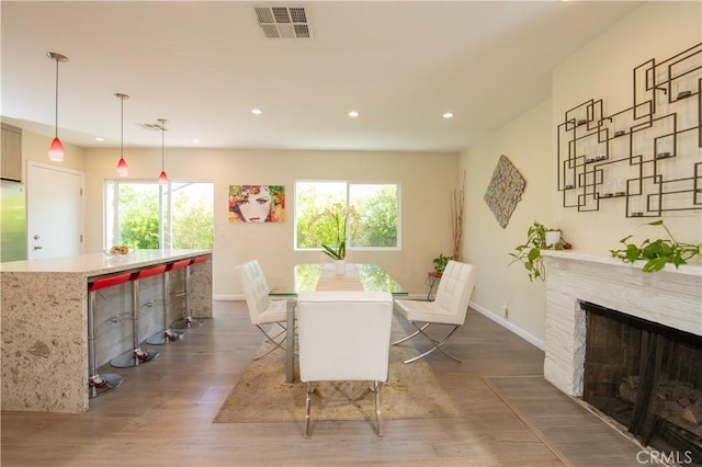 5427 Noble Ave, Sherman Oaks, CA 91411 - dining area with wood finished floors, recessed lighting, and a premium fireplace