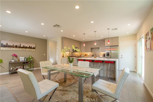 5427 Noble Ave, Sherman Oaks, CA 91411 - dining area with light wood finished floors and recessed lighting