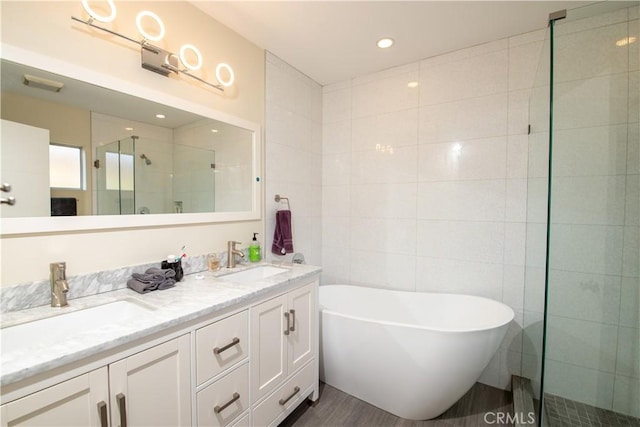 5427 Noble Ave, Sherman Oaks, CA 91411 - bathroom with a freestanding tub, double vanity, a shower stall, and tile walls