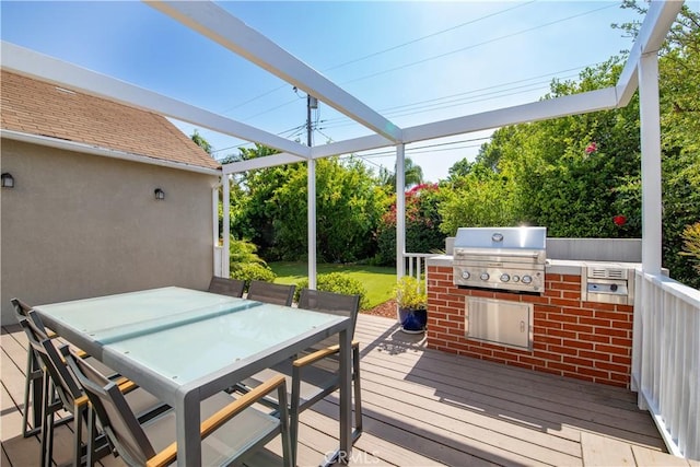 5427 Noble Ave, Sherman Oaks, CA 91411 - wooden terrace featuring outdoor dining space, an outdoor kitchen, and a yard