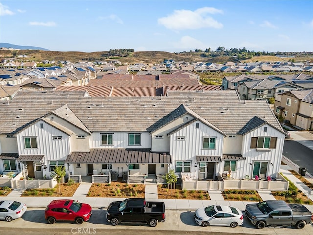 39376 Corvina Ln, Temecula, CA 92591 - view of front of house featuring board and batten siding, a residential view, a standing seam roof, a metal roof, and covered porch