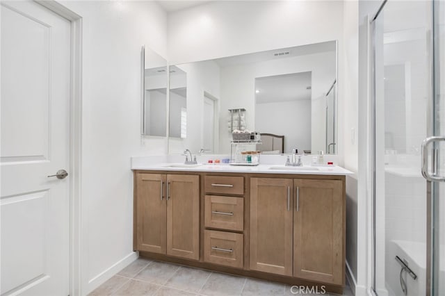39376 Corvina Ln, Temecula, CA 92591 - full bathroom featuring double vanity, a shower stall, and tile patterned floors