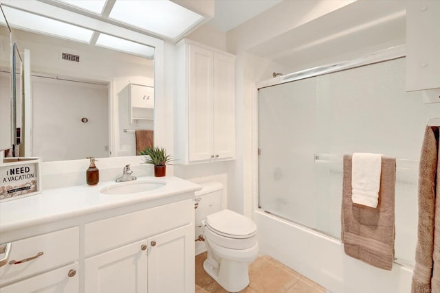 1616 Circa Del Lago Unit C206, San Marcos, CA 92078 - bathroom featuring vanity, toilet, enclosed tub / shower combo, and tile patterned floors