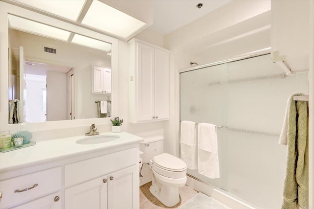 1616 Circa Del Lago Unit C206, San Marcos, CA 92078 - bathroom featuring a shower stall, vanity, and toilet