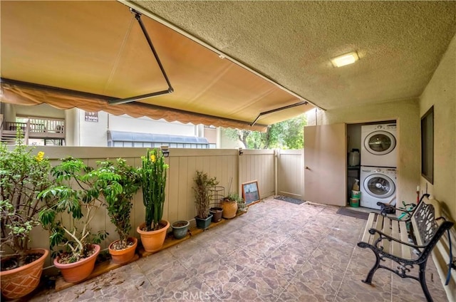 13602 La Jolla Cir Unit 16-C, La Mirada, CA 90638 - view of patio / terrace with stacked washing machine and dryer