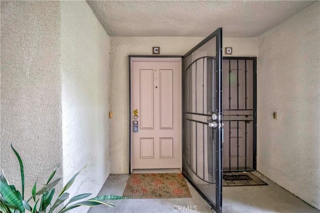 13602 La Jolla Cir Unit 16-C, La Mirada, CA 90638 - view of exterior entry with stucco siding