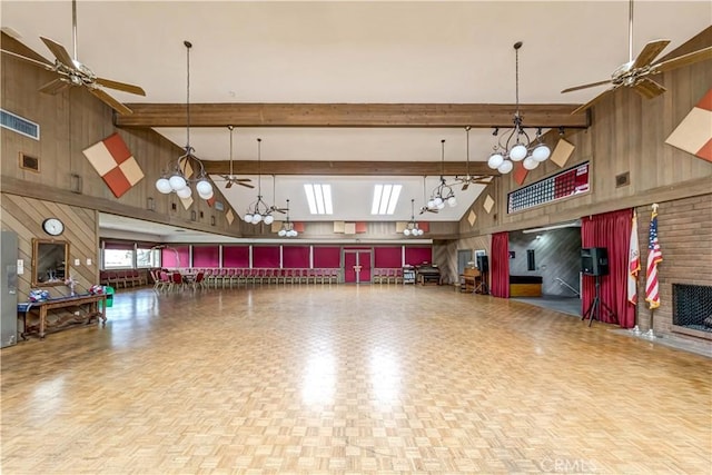 13602 La Jolla Cir Unit 16-C, La Mirada, CA 90638 - garage with wood walls, a ceiling fan, and a garage door opener