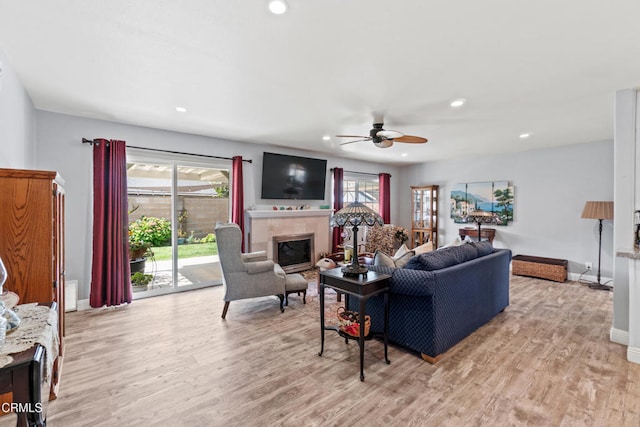1350 Elder St, Oxnard, CA 93036 - living area with a glass covered fireplace, a ceiling fan, light wood-style floors, and recessed lighting