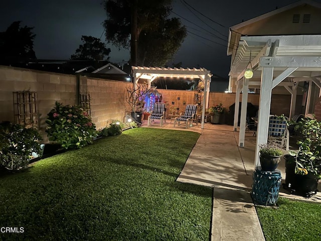 1350 Elder St, Oxnard, CA 93036 - yard at night with a patio, a fenced backyard, and a pergola